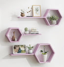 Hexagonal purple shelves on a white wall with decorative items.