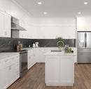 Modern kitchen with white cabinets, black marble backsplash, and stainless steel appliances.